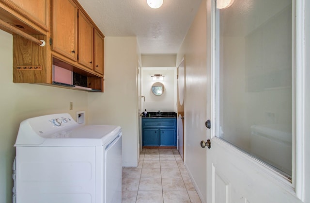 3623 Beech Hill Dr, Spring, TX 77388 - laundry area featuring washer / dryer, cabinet space, light tile patterned flooring, and a textured ceiling
