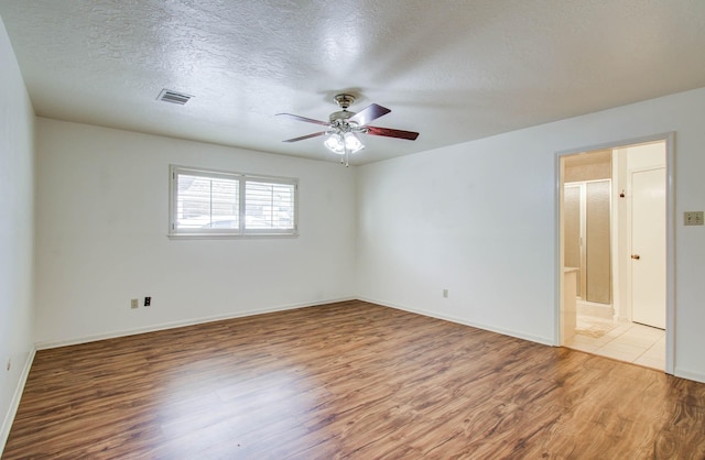 3623 Beech Hill Dr, Spring, TX 77388 - spare room featuring wood finished floors, ceiling fan, and a textured ceiling