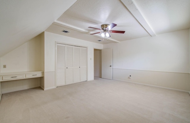 3623 Beech Hill Dr, Spring, TX 77388 - unfurnished bedroom featuring light carpet, lofted ceiling, a closet, ceiling fan, and a textured ceiling