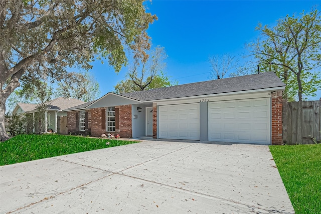 4323 Trafalgar Dr, Houston, TX 77045 - ranch-style house with brick siding, an attached garage, driveway, and a shingled roof