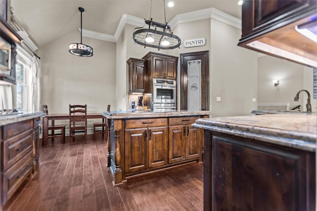 1207 Marigold Ln, Longview, TX 75604 - kitchen featuring light stone countertops, dark wood-style floors, a center island, stainless steel double oven, and crown molding