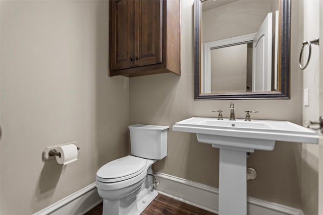 1207 Marigold Ln, Longview, TX 75604 - half bath with toilet and wood finished floors