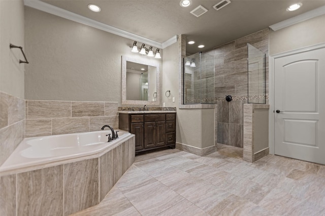 1207 Marigold Ln, Longview, TX 75604 - bathroom with crown molding, vanity, a bath, a walk in shower, and recessed lighting