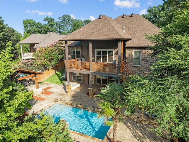 1207 Marigold Ln, Longview, TX 75604 - rear view of property featuring a shingled roof, a patio area, brick siding, stairs, and a deck