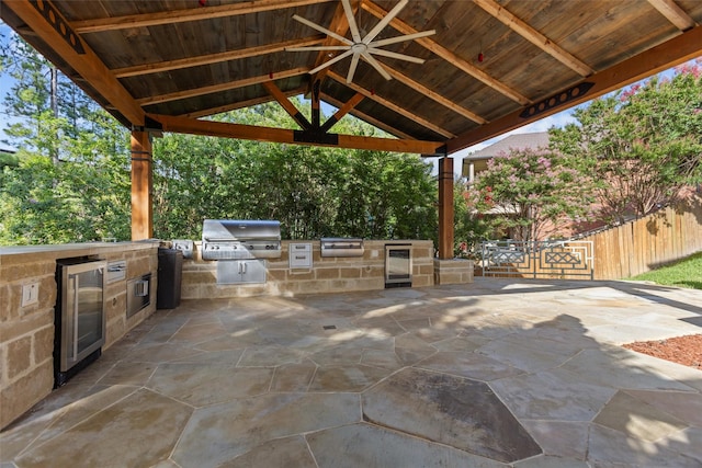 1207 Marigold Ln, Longview, TX 75604 - view of patio / terrace with beverage cooler, exterior kitchen, and a gazebo