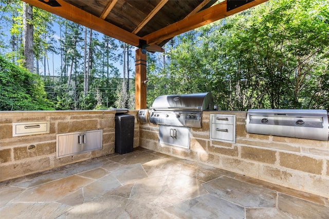 1207 Marigold Ln, Longview, TX 75604 - view of patio with an outdoor kitchen