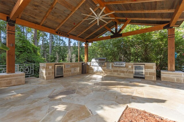 1207 Marigold Ln, Longview, TX 75604 - view of patio with wine cooler, area for grilling, a gazebo, and ceiling fan