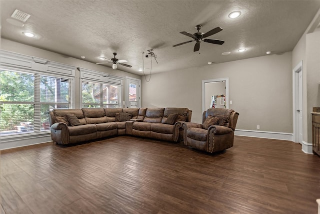 1207 Marigold Ln, Longview, TX 75604 - living area with a textured ceiling, ceiling fan, dark wood-style flooring, and recessed lighting
