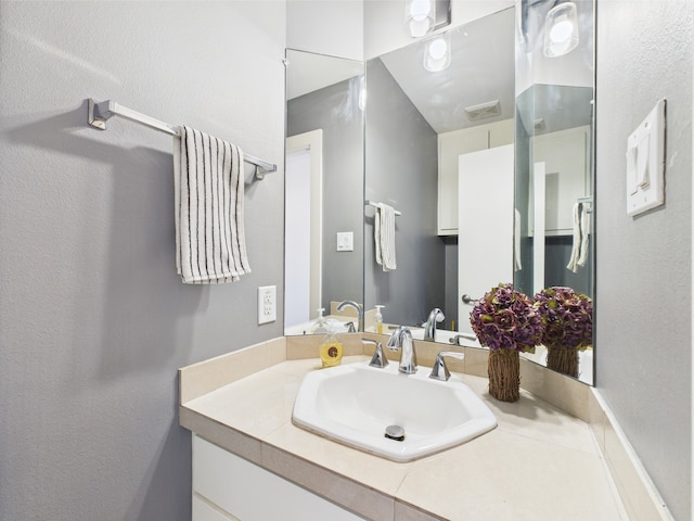 5810 Darling St Unit F, Houston, TX 77007 - bathroom featuring vanity and a textured wall