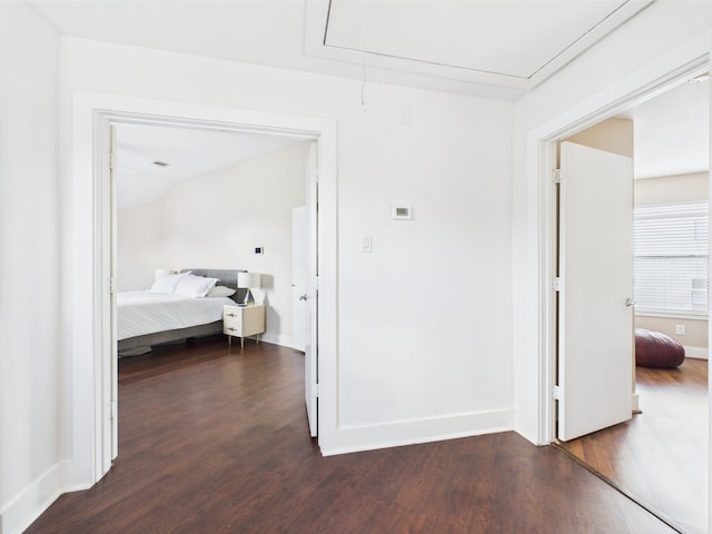 5810 Darling St Unit F, Houston, TX 77007 - hallway with attic access and dark wood-style flooring