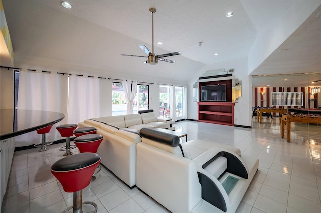 10730 Braes Bayou Dr, Houston, TX 77071 - living area featuring a ceiling fan, lofted ceiling, light tile patterned flooring, and recessed lighting