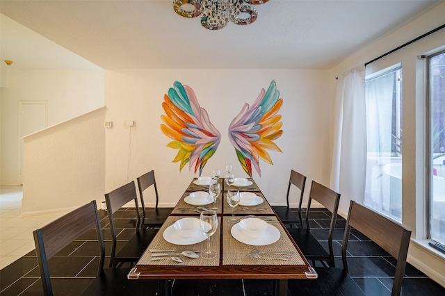 10730 Braes Bayou Dr, Houston, TX 77071 - tiled dining room with plenty of natural light and a chandelier