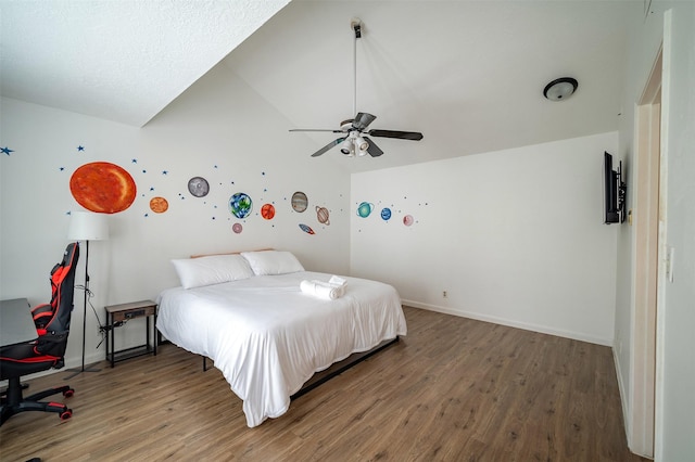 10730 Braes Bayou Dr, Houston, TX 77071 - bedroom with wood finished floors, vaulted ceiling, and a ceiling fan