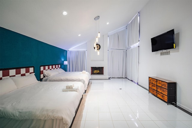 10730 Braes Bayou Dr, Houston, TX 77071 - bedroom featuring lofted ceiling, light tile patterned floors, a brick fireplace, and recessed lighting