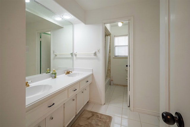 10730 Braes Bayou Dr, Houston, TX 77071 - full bath featuring double vanity, tile patterned flooring, and shower / bath combo with shower curtain