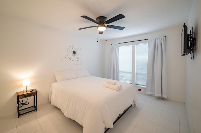 10730 Braes Bayou Dr, Houston, TX 77071 - bedroom with light tile patterned floors and a ceiling fan
