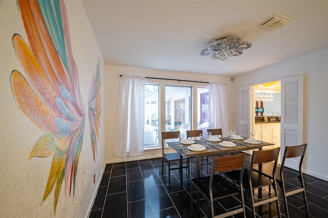 10730 Braes Bayou Dr, Houston, TX 77071 - dining room featuring dark tile patterned floors