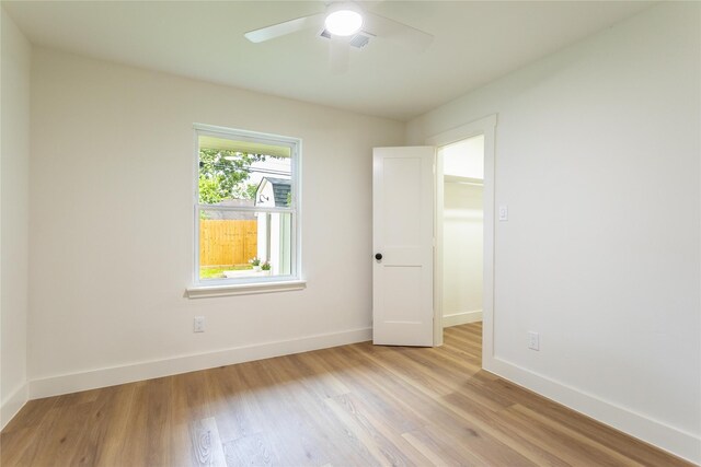 5318 Hialeah Dr, Houston, TX 77092 - unfurnished bedroom featuring light wood finished floors and a ceiling fan