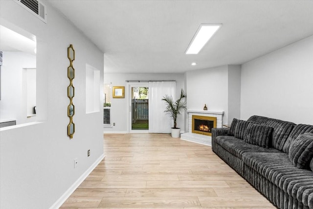 3220 69th St Unit E4, Galveston, TX 77551 - living room featuring light wood-type flooring, a brick fireplace, and recessed lighting