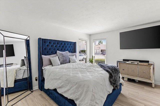 3220 69th St Unit E4, Galveston, TX 77551 - bedroom with wood finished floors and baseboards
