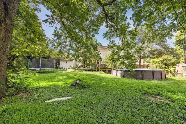 31730 Waller Tomball Rd, Waller, TX 77484 - view of yard with a trampoline and an outdoor pool