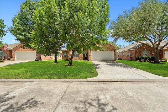 30607 N Sulphur Creek Dr, Magnolia, TX 77355 - obstructed view of property with an attached garage, concrete driveway, brick siding, and a front lawn