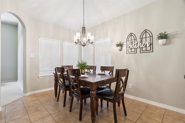 30607 N Sulphur Creek Dr, Magnolia, TX 77355 - dining space with arched walkways, light tile patterned floors, and a chandelier