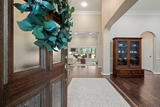 28322 Buena Way, Spring, TX 77386 - entryway with arched walkways, ornamental molding, and hardwood / wood-style flooring