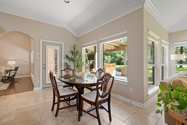 28322 Buena Way, Spring, TX 77386 - dining room with stone tile floors, ornamental molding, and arched walkways