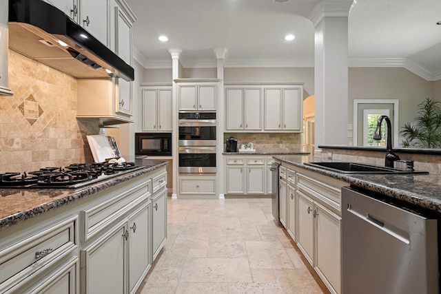 28322 Buena Way, Spring, TX 77386 - kitchen with appliances with stainless steel finishes, under cabinet range hood, tasteful backsplash, stone tile floors, and crown molding