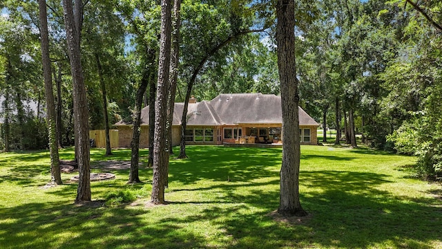 28322 Buena Way, Spring, TX 77386 - view of front facade with a front lawn and a chimney