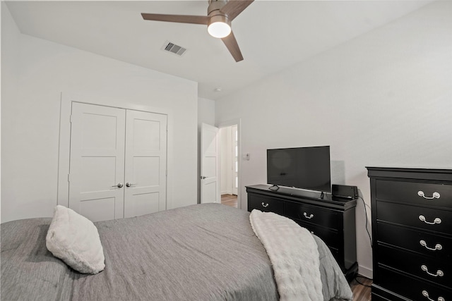 14320 Yellow Hawthorn Ct, Conroe, TX 77384 - bedroom with a closet, dark wood-type flooring, and a ceiling fan