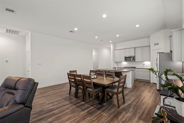 14320 Yellow Hawthorn Ct, Conroe, TX 77384 - dining space with dark wood-style flooring and recessed lighting