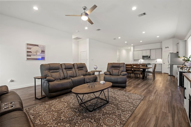 14320 Yellow Hawthorn Ct, Conroe, TX 77384 - living area featuring a ceiling fan, dark wood-style floors, lofted ceiling, and recessed lighting