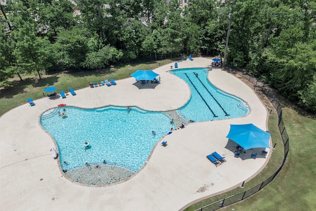 14320 Yellow Hawthorn Ct, Conroe, TX 77384 - community pool featuring a patio