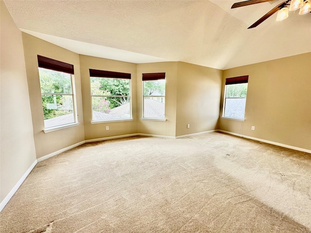 2716 W Oaks Cir E, Pearland, TX 77584 - unfurnished room featuring light colored carpet, ceiling fan, a textured ceiling, and vaulted ceiling