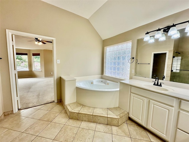 2716 W Oaks Cir E, Pearland, TX 77584 - full bath featuring vaulted ceiling, a bath, vanity, tile patterned floors, and ceiling fan