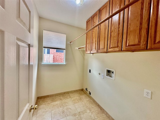2716 W Oaks Cir E, Pearland, TX 77584 - laundry room featuring washer hookup, cabinet space, hookup for an electric dryer, gas dryer hookup, and light tile patterned flooring