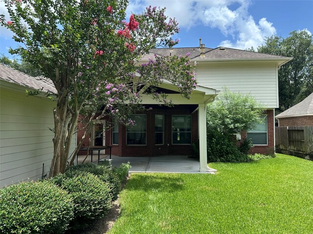 2716 W Oaks Cir E, Pearland, TX 77584 - back of house with a patio and brick siding