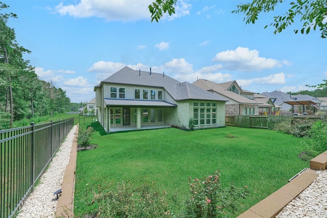 237 Patina Sorrel Dr, Montgomery, TX 77316 - back of house with a fenced backyard, roof with shingles, and a patio area