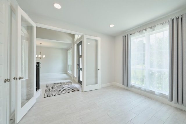237 Patina Sorrel Dr, Montgomery, TX 77316 - empty room featuring french doors, plenty of natural light, recessed lighting, and a chandelier
