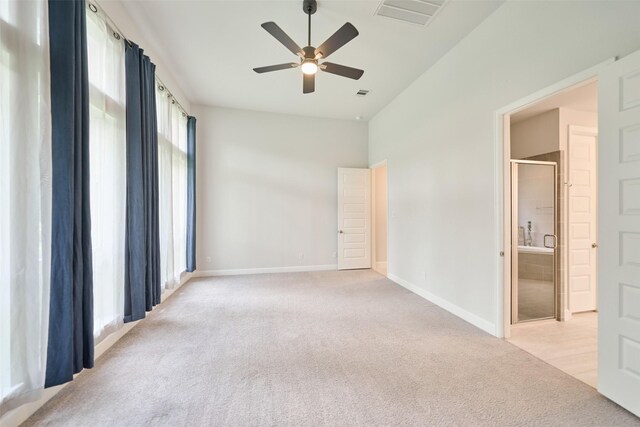 237 Patina Sorrel Dr, Montgomery, TX 77316 - unfurnished bedroom with light carpet, ensuite bath, and a ceiling fan