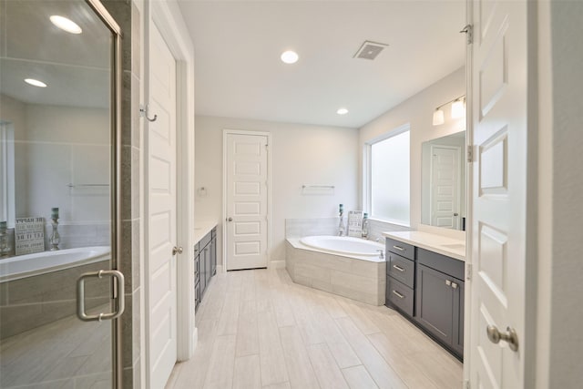 237 Patina Sorrel Dr, Montgomery, TX 77316 - full bathroom featuring vanity, a bath, a shower stall, and recessed lighting