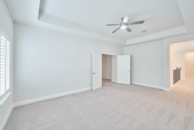 237 Patina Sorrel Dr, Montgomery, TX 77316 - unfurnished bedroom with a raised ceiling, light carpet, and a ceiling fan