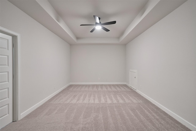 237 Patina Sorrel Dr, Montgomery, TX 77316 - empty room featuring ceiling fan, carpet flooring, and a tray ceiling
