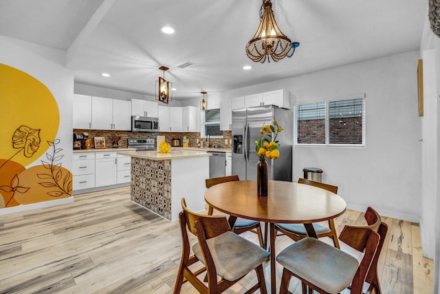5918 Lattimer Dr, Houston, TX 77035 - dining space featuring recessed lighting and light wood finished floors