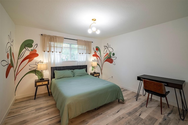 5918 Lattimer Dr, Houston, TX 77035 - bedroom with light wood-style floors and baseboards