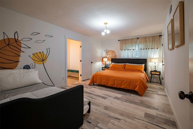5918 Lattimer Dr, Houston, TX 77035 - bedroom with light wood-style flooring and ensuite bath