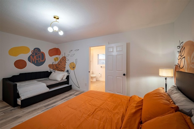 5918 Lattimer Dr, Houston, TX 77035 - bedroom featuring light wood-type flooring and ensuite bathroom
