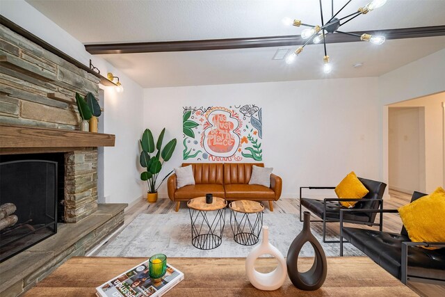 5918 Lattimer Dr, Houston, TX 77035 - living area featuring a chandelier, wood finished floors, beamed ceiling, and a fireplace